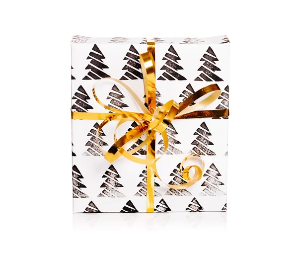 Geschenkpapier bemalt mit schwarzer Schleife auf weißem Hintergrund. Muster mit Weihnachtsbaum — Stockfoto