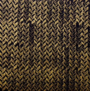 Siyah zemin üzerine altın damgalı desen.