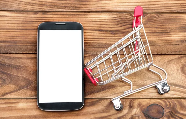 Blank Smartphone Shopping Cart Wooden Background Copy Space Online Shopping — Stock Photo, Image