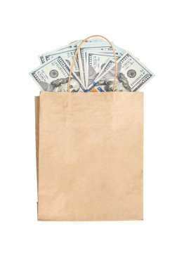 Money scattered from paper bag on white background. Top view.