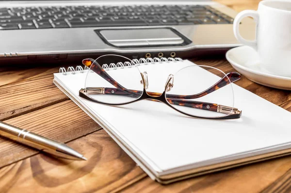 Business Workplace Notepad Eyeglasses Cup Coffee Laptop — Stok fotoğraf