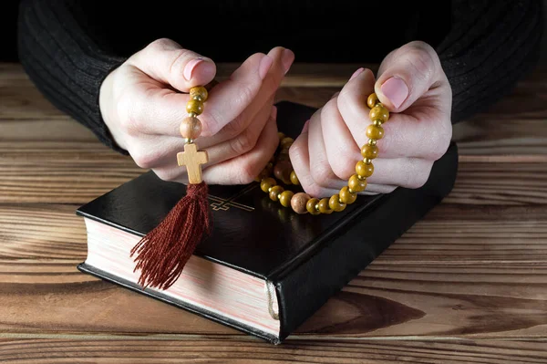 Woman Praying Holding Rosary Beads Table Holy Bible Religion Concept — Stok Foto