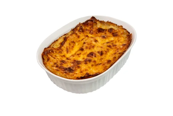 Lasagne dans un plat de cuisson sur fond blanc — Photo