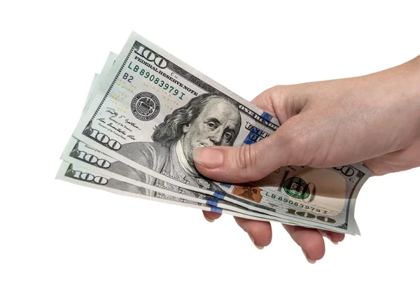 Доллары США в женской руке — стоковое фото