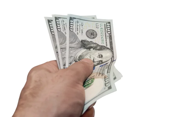 Доллары США в руке — стоковое фото