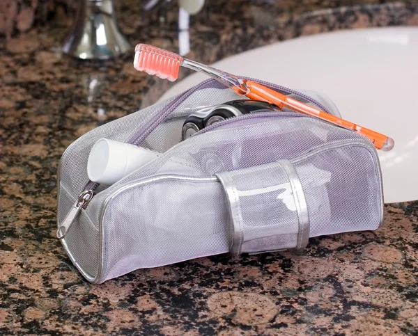 Toiletry bag with items in the inside — Stock Photo, Image