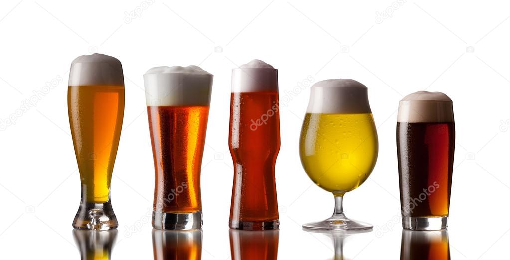 Several glasses of beer with cap of foam