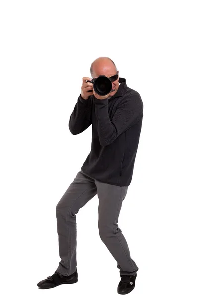 Fotógrafo segurando uma câmera profissional — Fotografia de Stock