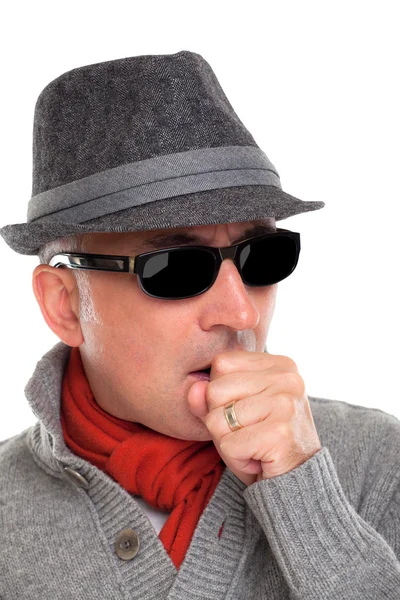 Elegante hombre tosiendo con un sombrero —  Fotos de Stock