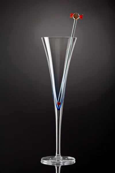 Одиночна шампанська флейта зі скляним мішалкою — стокове фото
