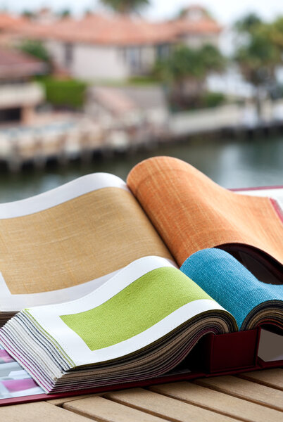 Upholstery fabric samples with the view of homes in the background