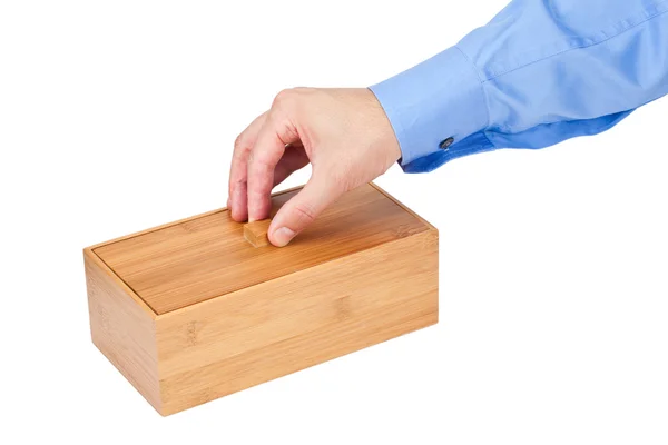 Hand about to open a wooden box — Stock Photo, Image