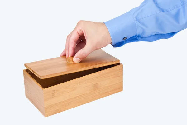 Hand opening a wooden box — Stock Photo, Image