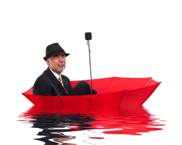 Uomo d'affari che piange mentre galleggia su unbrella — Foto Stock