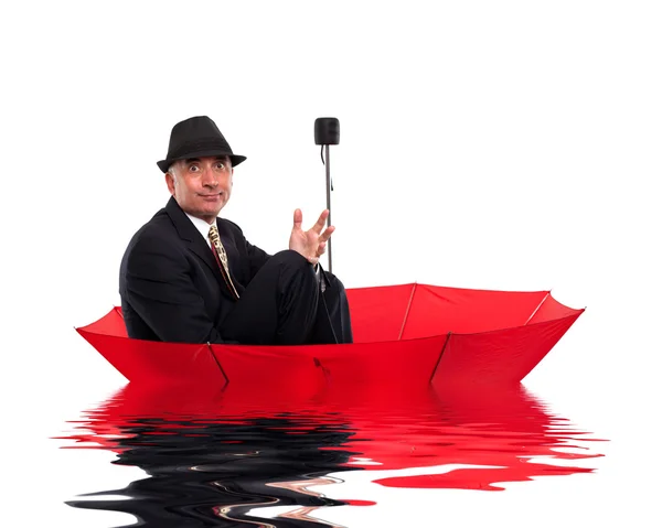 Business man floating on umbrella — Stock Photo, Image