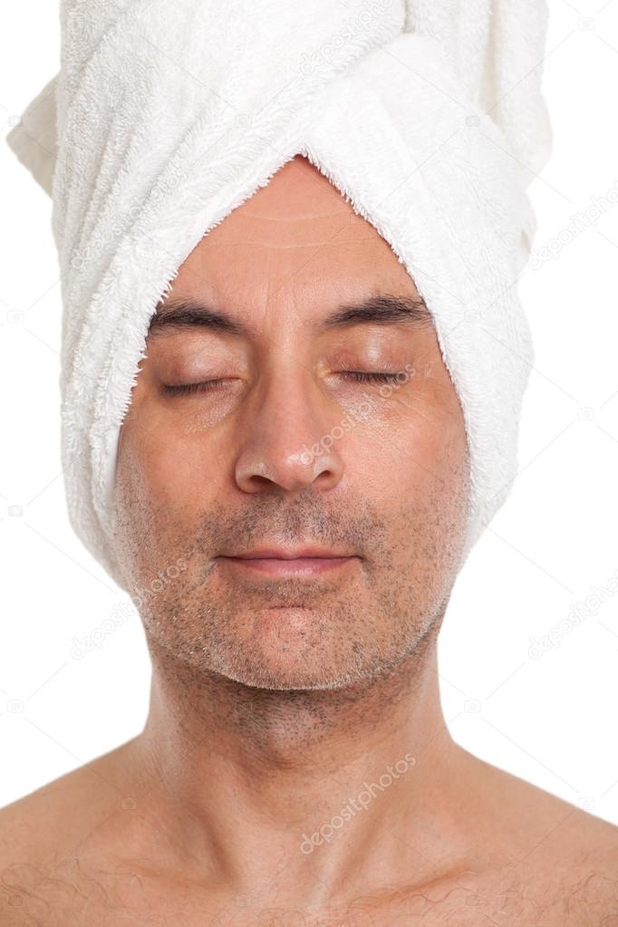 Man with a towel wrapped in his head