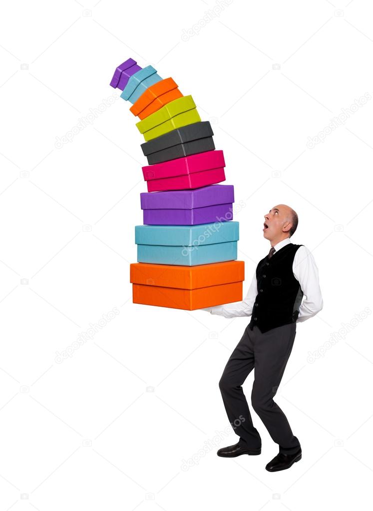 Handsome man holding colorful gift boxes