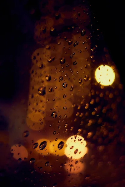 Abstrakte Kreisförmige Bokeh Hintergrund Des Nachtlichts Mit Regentropfen — Stockfoto