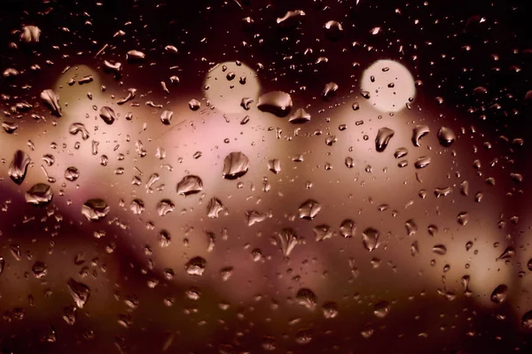 Gece Lambasının Yağmur Damlalı Soyut Dairesel Bokeh Arkaplanı — Stok fotoğraf