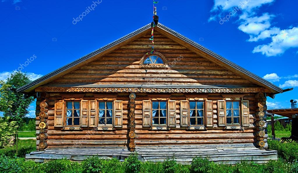 Traditional russian house (izba). Stock Photo by ©vasilygureev 89372664