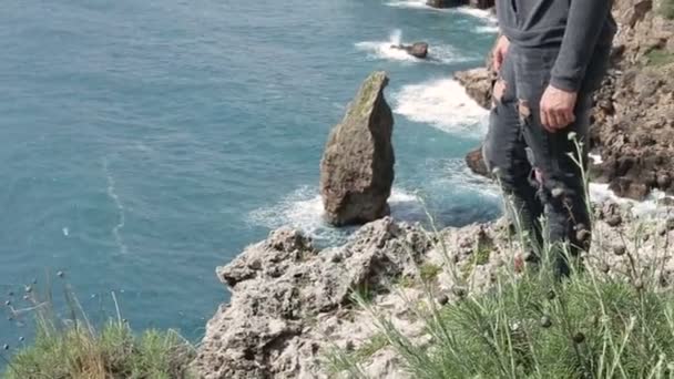 Women standing  on the  mouintain and  looking straight ahead. On the background on the Mediterranean seafront in sunny day. — Stock Video