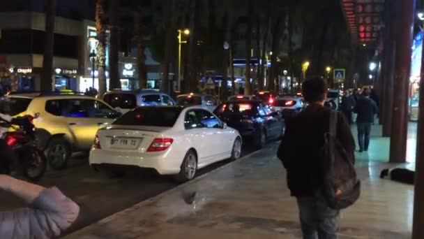 Antalya, Turkey - March 2016: a lively main street at night, people go, go cars — Stock Video