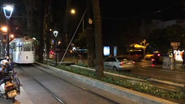 Antalya, Turkey - March 2016: a lively main street at night, people go, go cars — Stock Video