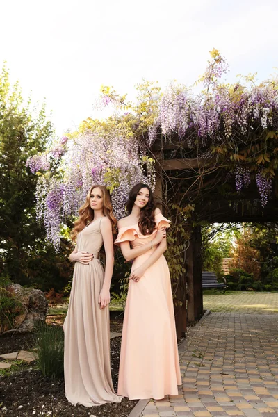 Women in blossom spring garden — Stock Photo, Image