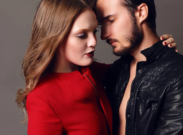 Fashion studio photo of beautiful sexy couple — Stock Photo, Image