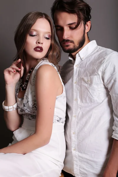 Fashion studio photo of beautiful sexy couple — Stock Photo, Image