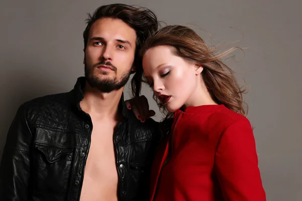 Fashion studio photo of beautiful sexy couple — Stock Photo, Image