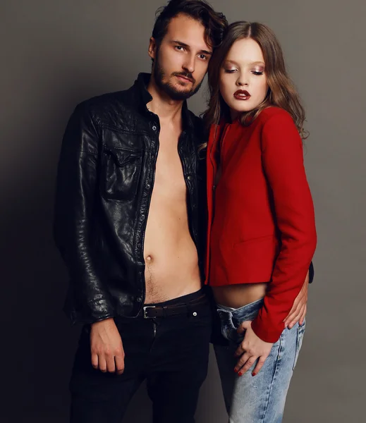 Fashion studio photo of beautiful sexy couple — Stock Photo, Image