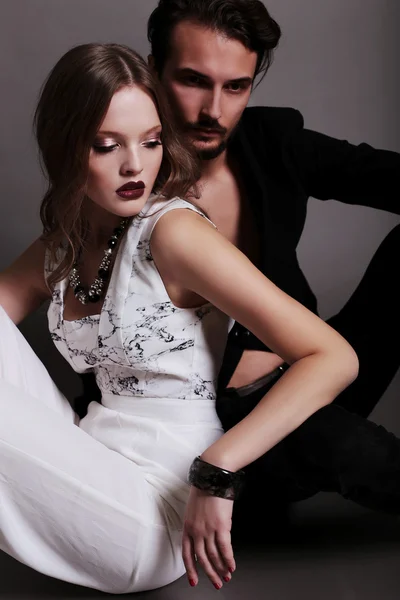 Fashion studio photo of beautiful sexy couple — Stock Photo, Image