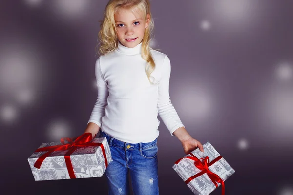 little santa girl with Christmas presents