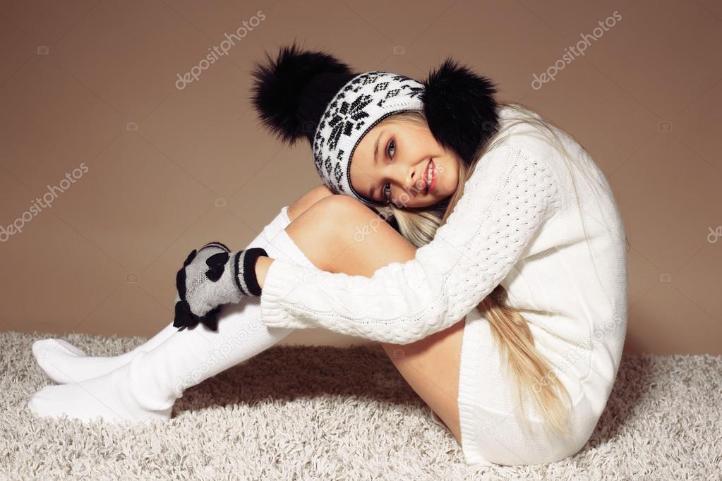beautiful little girl in knitted clothes