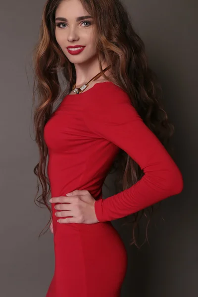 Beautiful woman in elegant red dress — 图库照片