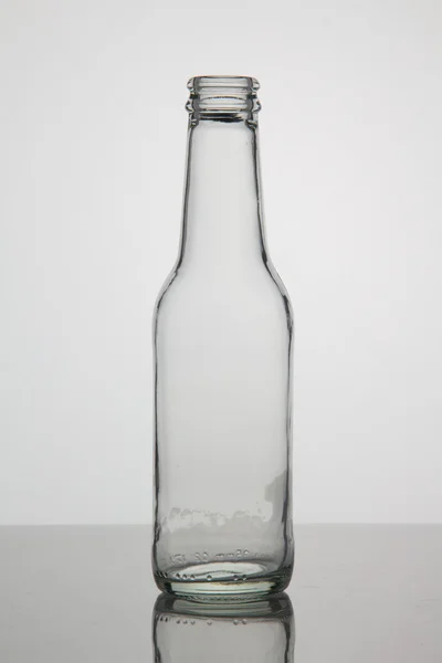 Botella vacía sobre fondo blanco — Foto de Stock