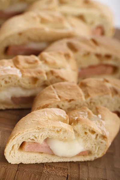 Stromboli - italian sandwich filled with ham and cheese — Stock Photo, Image