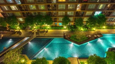 gece ışık daire blok Yüzme Havuzu panorama 4 k zaman sukut Tayland