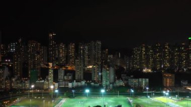 Aydınlatılmış Hong Kong şehrinin hava manzarası, Gece, 4k  
