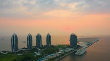 Aerial panorama of Sanya cityscape at sunset. China, timelapse, 4k 