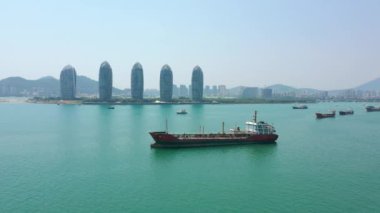 Aerial panorama bay ships parking at Sanya city, sunny day, 4k. Hainan island, China 