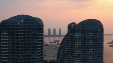 Aerial panorama of famous hotel complex at Sanya city, daytime, 4k. Hainan island, China