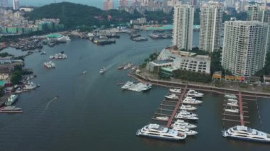 Aerial panorama of river traffic dock at Sanya city, daytime 4k. Hainan island, China