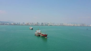 Aerial panorama bay ships parking at Sanya city, sunny day, 4k. Hainan island, China 