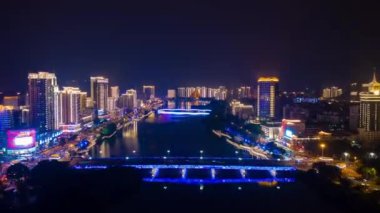 Aerial panorama of illuminated Sanya bay, nighttime, China, time-lapse 4k 