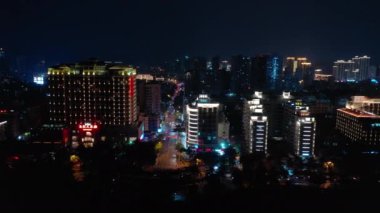 Aerial panorama of night time illumination at Sanya city, 4k. Hainan island, China
