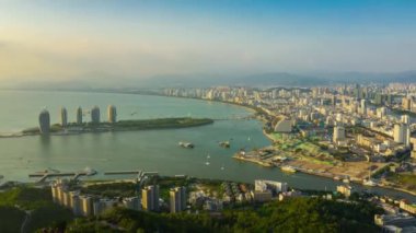Aerial panorama of Sanya cityscape at sunset. China, timelapse, 4k 