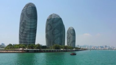 Aerial panorama of famous hotel complex at Sanya city, daytime, 4k. Hainan island, China