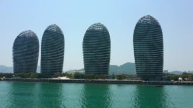 Aerial panorama of famous hotel complex at Sanya city, daytime, 4k. Hainan island, China